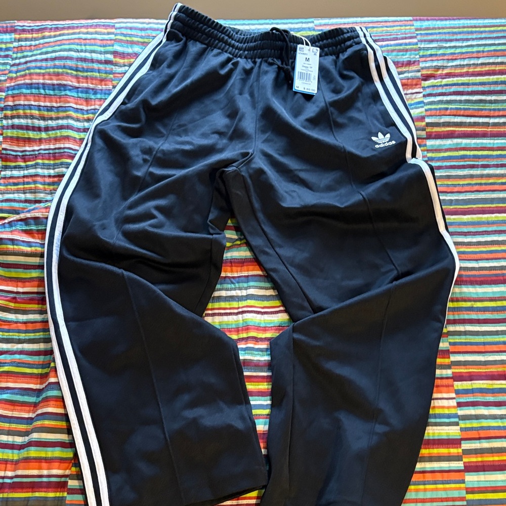 Adidas baggy Tp Black Joggers with White Stripes size medium, newer tags